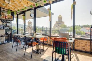 Acquire an operational boutique hotel and café with existing bookings and staff in Tbilisi.