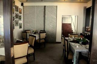 Global cuisine restaurant with seating for 85+ patrons hosting live music and stand-up events.