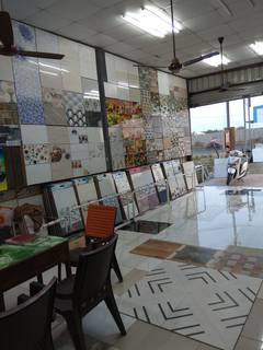 Business in Bhiwandi selling ceramic tiles, cement and building materials through a showroom.