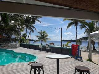 For Sale: Beachfront resort featuring bungalows, dining, recreational amenities, with strong brand and customer demand.