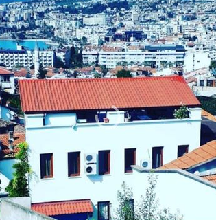 Established Airbnb hospitality business for sale with panoramic rooftop views and growth potential.