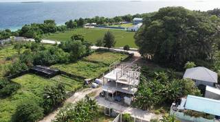 3-storied guest house with 6 rooms and a restaurant, 60% finished structure seeks an investor.