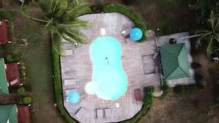 For sale: Beachfront resort offering accommodations and sunset views for tourists and retreats.