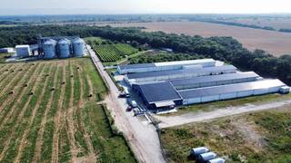 Vertically integrated agro-industrial platform with 12,000-ton grain storage capacity, logistics infrastructure, and renewable energy component.