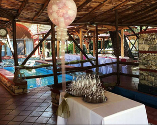 Operational Greek hospitality property with event infrastructure seeking sale within growing cultural tourism market.