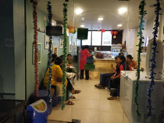 Ice cream shop with seating capacity of 13 pax and receiving 80-100 daily customers.