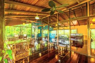Non-operational nature-view Caribbean restaurant and treehouse event venue at Nauyaca Waterfalls, with expansion opportunities.