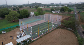 For Sale: Sports turf for cricket and football with a café and seating area.