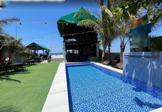 Operational beachfront surf and scuba resort in San Narciso, with 16 rooms and diverse services.