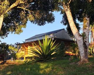 Eco-tourism investment opportunity for developing a nature retreat with planned cottage expansion.