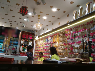 Business dealing in fashion accessories and imitation jewellery with retail store in a mall.