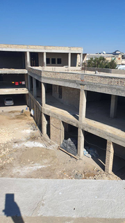 UNESCO-zone boutique hotel project in Bukhara Old City with partially constructed structure and expansion potential.