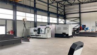 Modern 2.5-hectare metal processing center in Poland with CNC machinery, warehouses, and office facilities for sale.