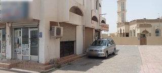Neighborhood laundry business in Muscat specializing in ironing services with a loyal local customer base.
