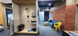 Tile/bath fitting store with contractor network, offering database and location for rental to buyer.