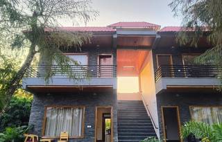 Luxurious 21-room resort in Nainital offering premium accommodations, event hosting, and scenic destination weddings.